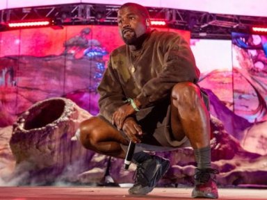 Kanye posts photos of his record deal amid dispute